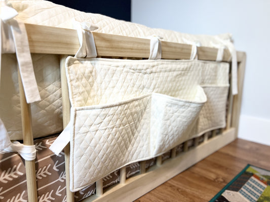 Montessori floor bed, solid hardwood, non-toxic, with diamond book caddy and pillow covers.