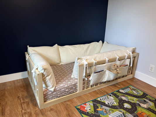 Montessori floor bed, natural poplar hardwood, non-toxic, with diamond pillow cover and book caddy.