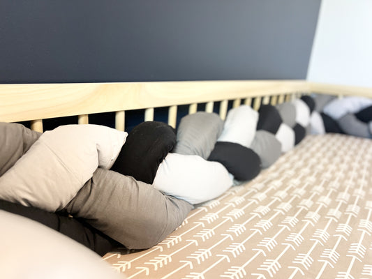 Montessori floor bed, solid hardwood, non-toxic, with tri color braided bumper.