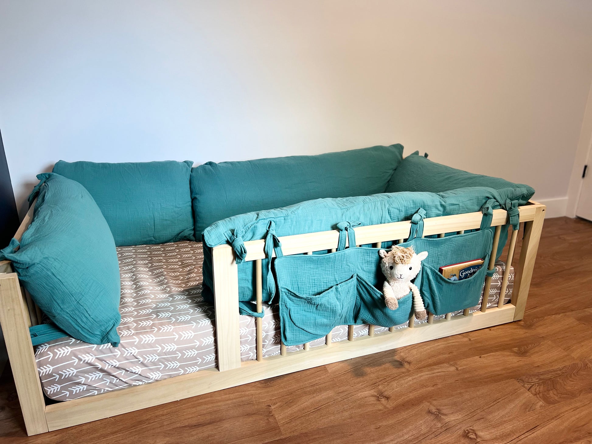 Soft cotton book caddy on floor bed.