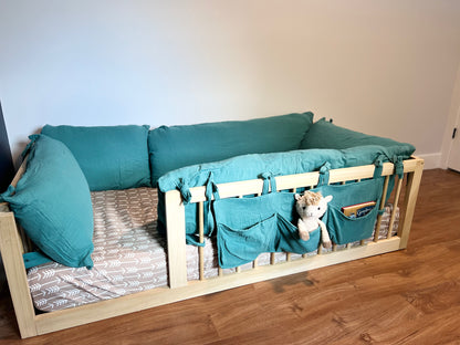 Soft cotton book caddy on floor bed.
