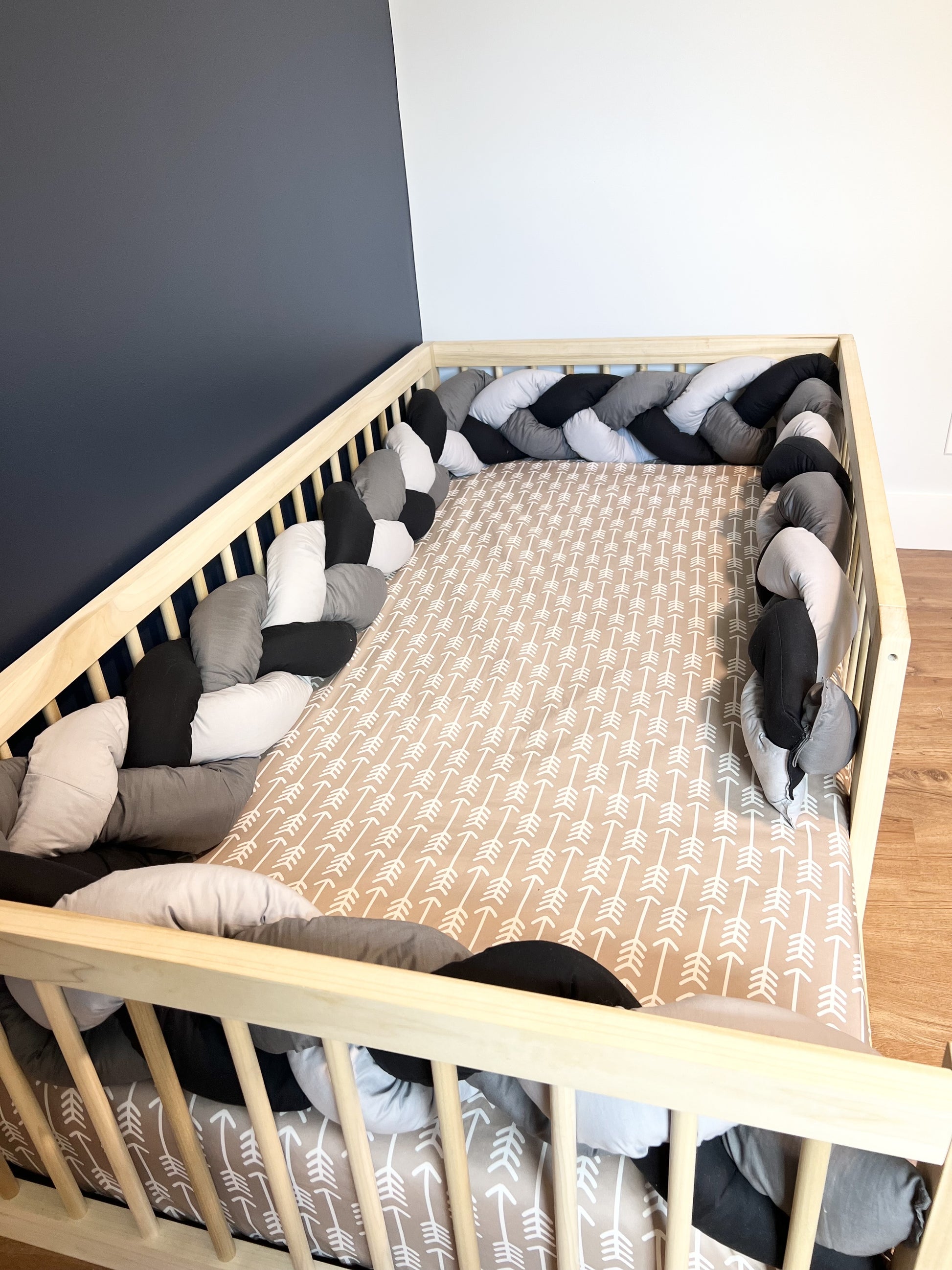 Montessori floor bed, solid hardwood, non-toxic, tri color braided bumper.
