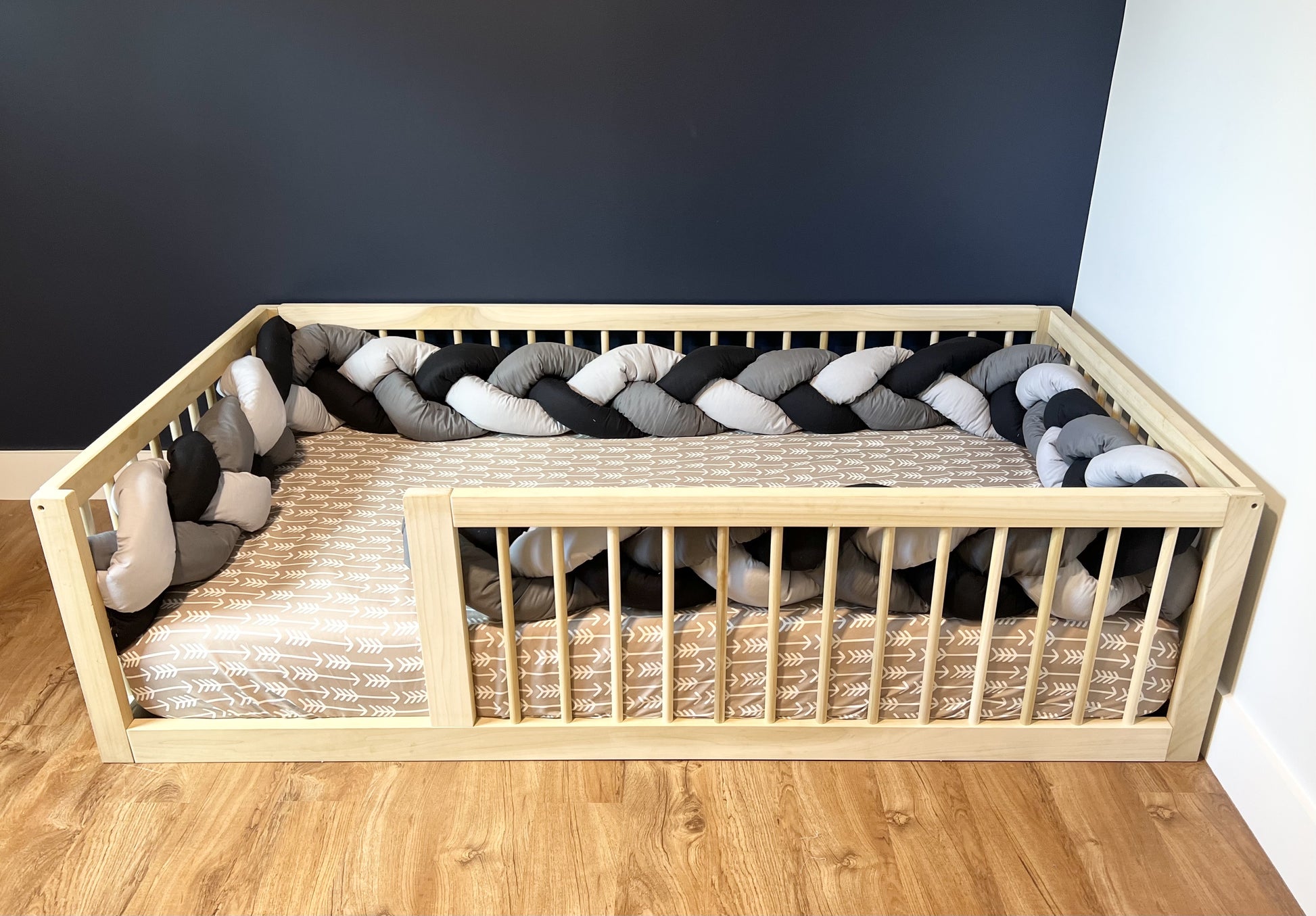 Montessori floor bed, solid hardwood, non-toxic, with tri color braided bumper.