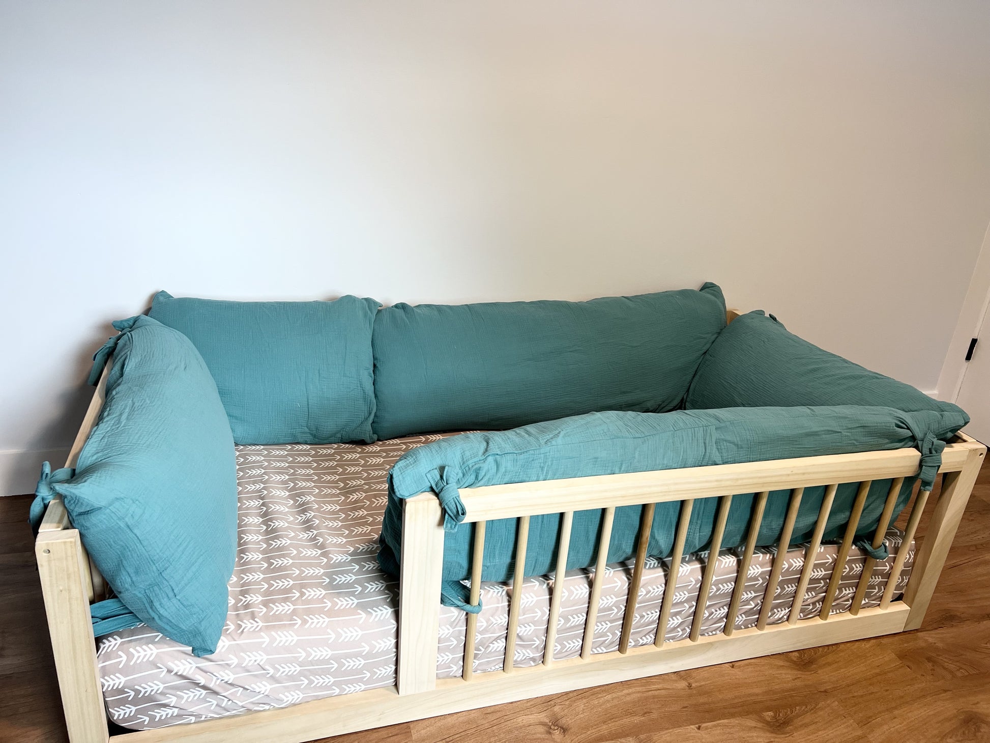 Montessori floor bed, solid hardwood, non-toxic, with soft cotton pilllow covers.