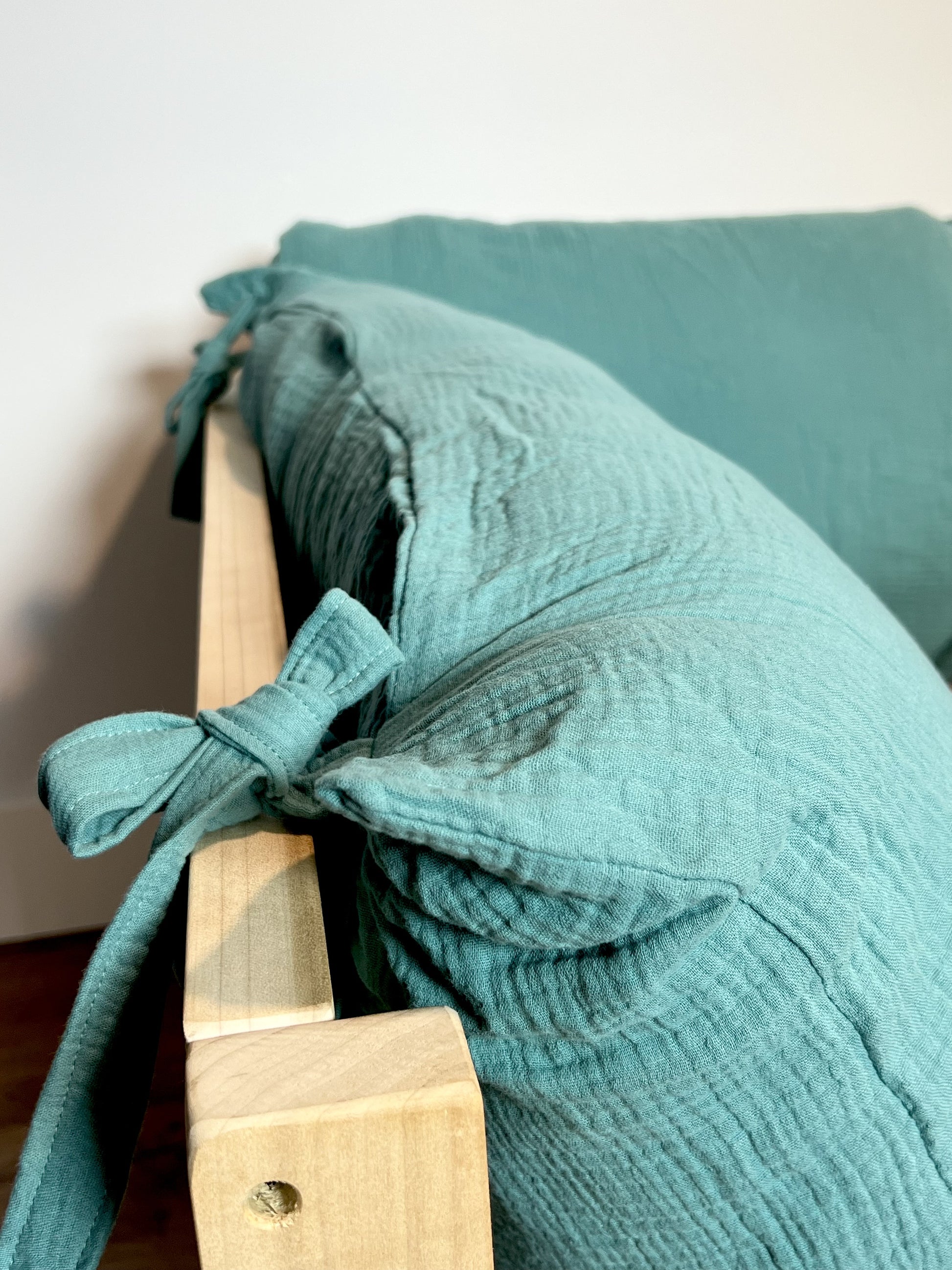 Soft cotton pillow cover on floor bed.