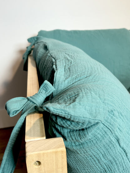 Soft cotton pillow cover on floor bed.
